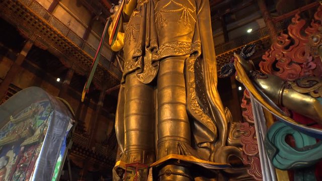 Buddha golden statue Gandan Gandantegchinlen Chinese-style Tibetan Buddhist Monastery. Center of Mongolian capital of Ulaanbaatar. Religion world famous attraction. 