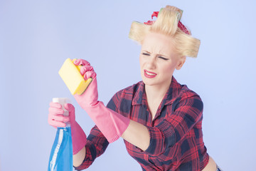  Housewife holding a cleaning spray