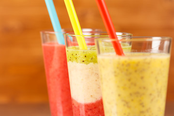 3 different smoothies with straws, low focus,