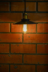 Old lamp and brick wall