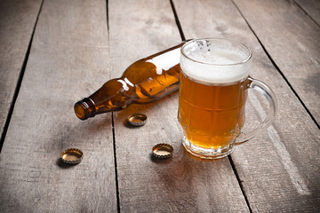 glass beer on wood background