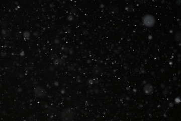 snow on a black background texture overlay bokeh highlights
