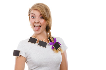 Teenage girl having little blackboards in hair