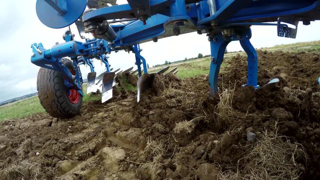 in    from a on-board-camera on a plought of a tractor on a acre