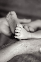 great-grandmother holds the legs