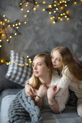 mom and daughter with long  blond hair, lifestyle