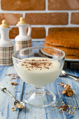 Yogurt cream for cake with chocolate and nut crumbs.