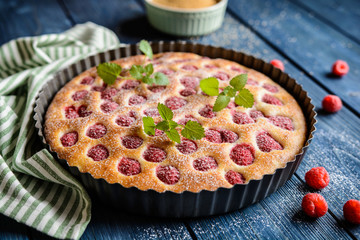 Juicy raspberry pie with powdered sugar icing