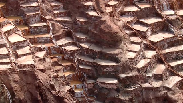  well known Maras salt evaporation pond in the Andes of Peru in the Region of Cusco (Cuzco). South America