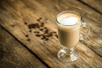 Coffee cup and coffee beans on table