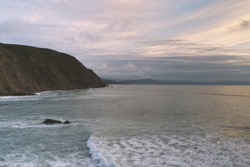 Clouds sky and sunlight gold sunset on horizon ocean. Background seascape dramatic atmosphere rays sunrise. Relax view waves water sea, mock up nature evening concept perspective sunrise