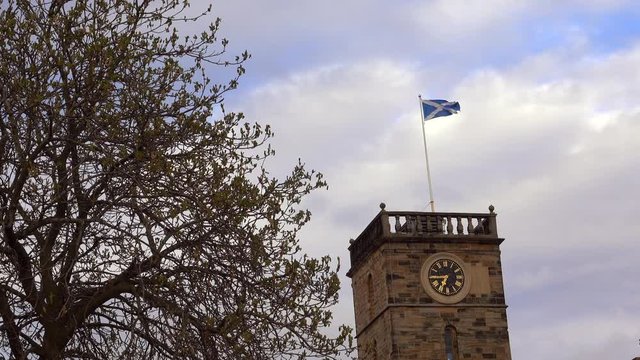 Scottish flag flying over clock tower at Linlithgow Palace
