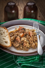 Traditional polish sauerkraut (bigos) with mushrooms and meat.