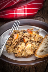 Traditional polish sauerkraut (bigos) with mushrooms and meat.