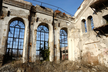 Fototapeta na wymiar Ruined broken windows of old abandoned plant,Odessa,Ukraine
