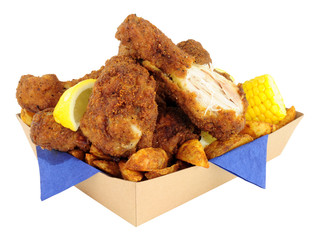Southern fried chicken portions in a cardboard take away tray isolated on a white background