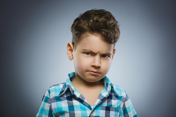 angry boy isolated on gray background