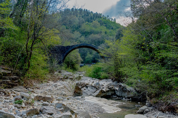 Fototapeta na wymiar Ancient medieval stone bridge in siena in tuscany