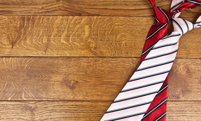 two necktie against the backdrop of oak boards
