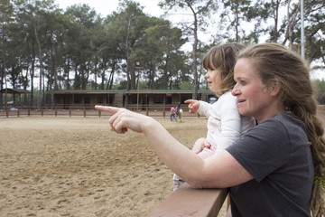 mother and child on horse range