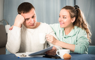 Fototapeta premium Couple struggling to pay bills