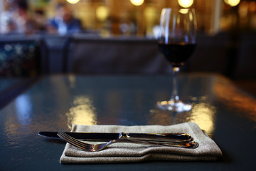 Serving a glass of red wine in a restaurant