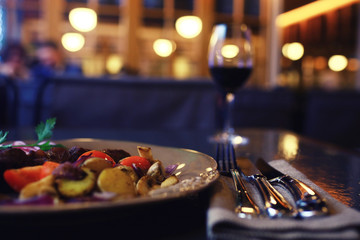 Serving a glass of red wine in a restaurant
