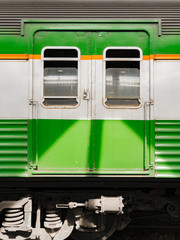 The side of the old green train at the Bangkok Railway Station. - 144897880