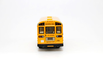 Yellow school bus kids toy on white background