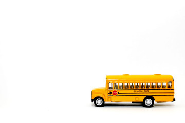Yellow school bus kids toy on white background