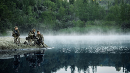 Special forces soldiers with weapon take part in military maneuver. war, army, technology and...