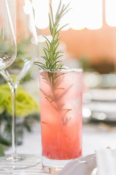 pink cocktail placed on wedding table