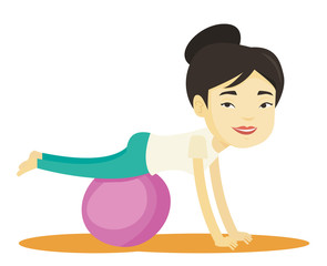 Young woman exercising with fitball.