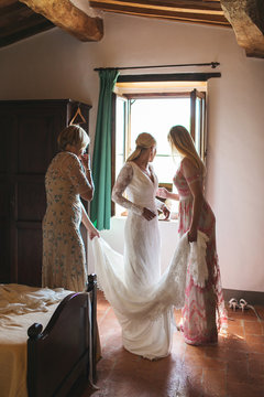 Bride getting ready in old Tuscan house