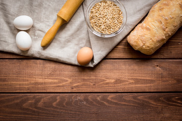 bakery concept with homemade bread on rustic background top view moke-up