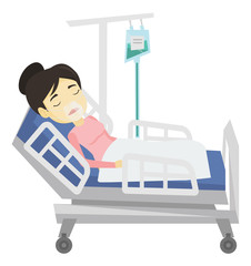 Patient lying in hospital bed with oxygen mask.