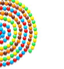 Swirl made of delicious candies on white background