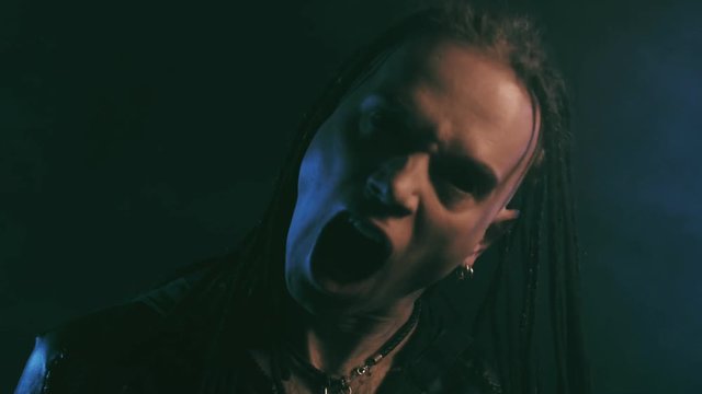 Horror scene with suffering demon man have many terrible faces