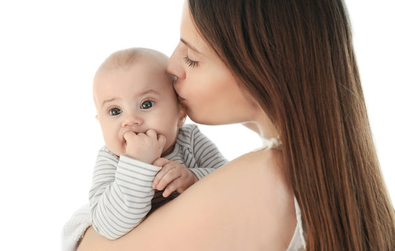 Adorable baby with mother on light background