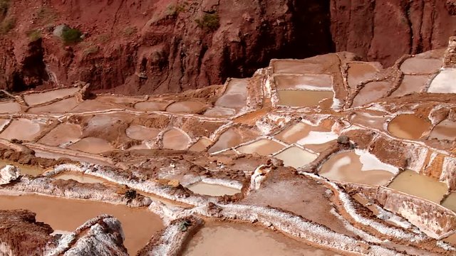  well known Maras salt evaporation pond in the Andes of Peru in the Region of Cusco (Cuzco). South America