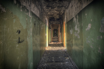 Abandoned building.A dark corridor in a ruined building