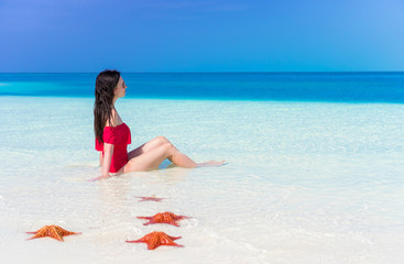 Young beautiful woman during tropical beach vacation