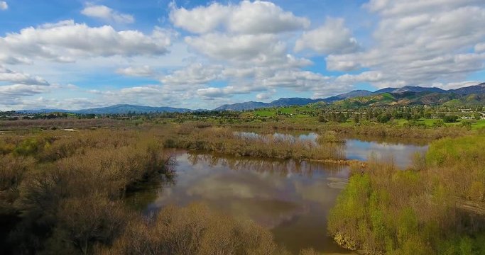 Big clouds over Hansen Dam Reservoir in Sylmar, CA 4k 24fps