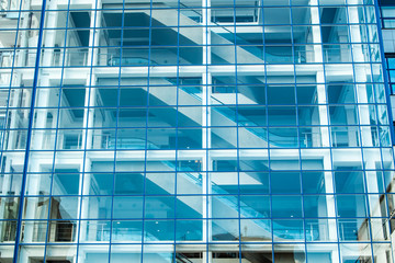 Fototapeta na wymiar Glass facade of the building with escalator.