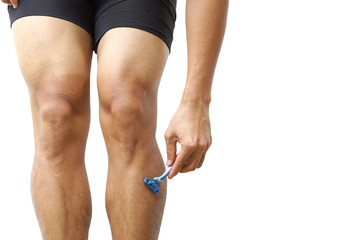 A male cyclist shaving his legs for improving aerodynamics isolated