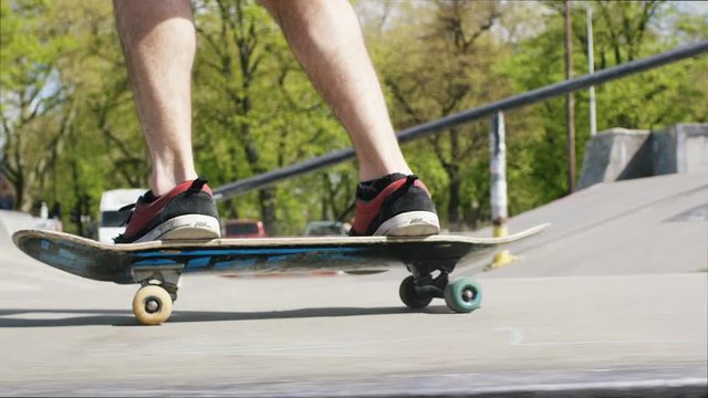Close up shot of a skateboarder doing flips, in slow motion