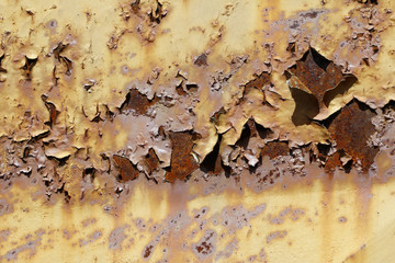 Flaky paint on the old rusty metal