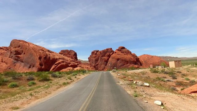 Incredibly beautiful landscape in Southern Nevada, Valley of Fire State Park, USA. Smooth camera movement along the road.