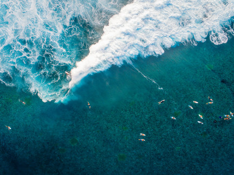 Surfers in sea, Teahupoo, Tahiti, South Pacific