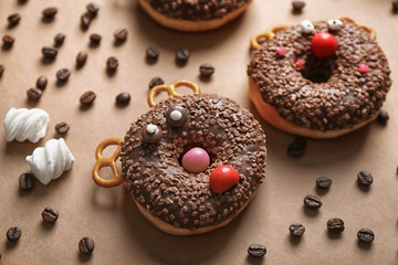 Fototapeta na wymiar Funny decorated donuts on table